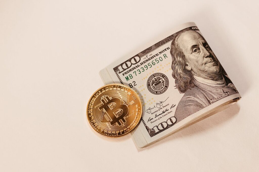 gold bitcoin coin and cash